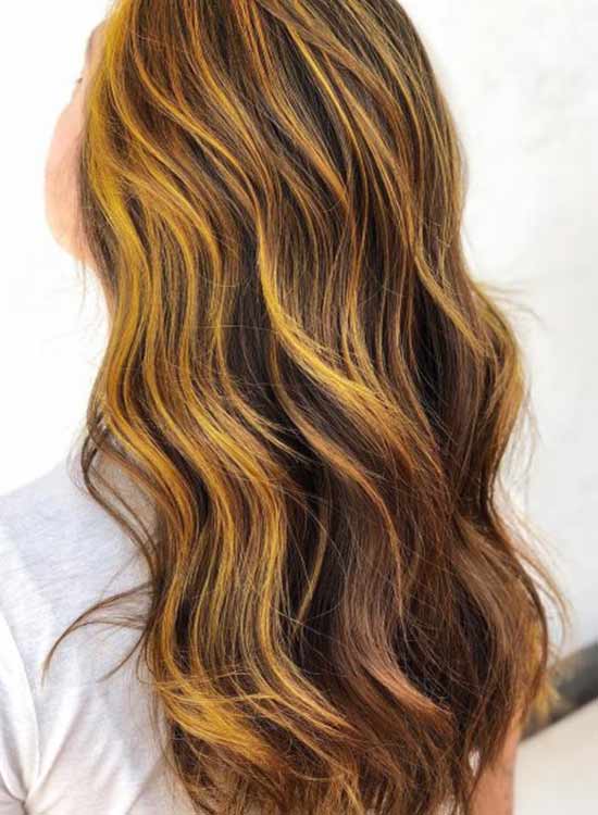 Yellow hair highlight dark brown brunette hair